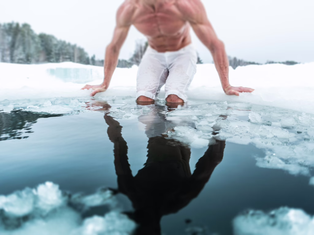 Man getting in ice water