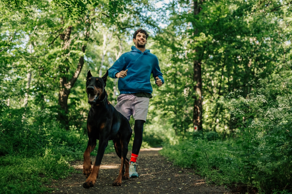 Man running with dog