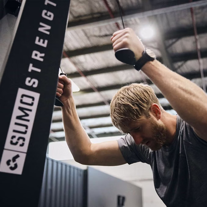 A man using a branded SkiErg machine