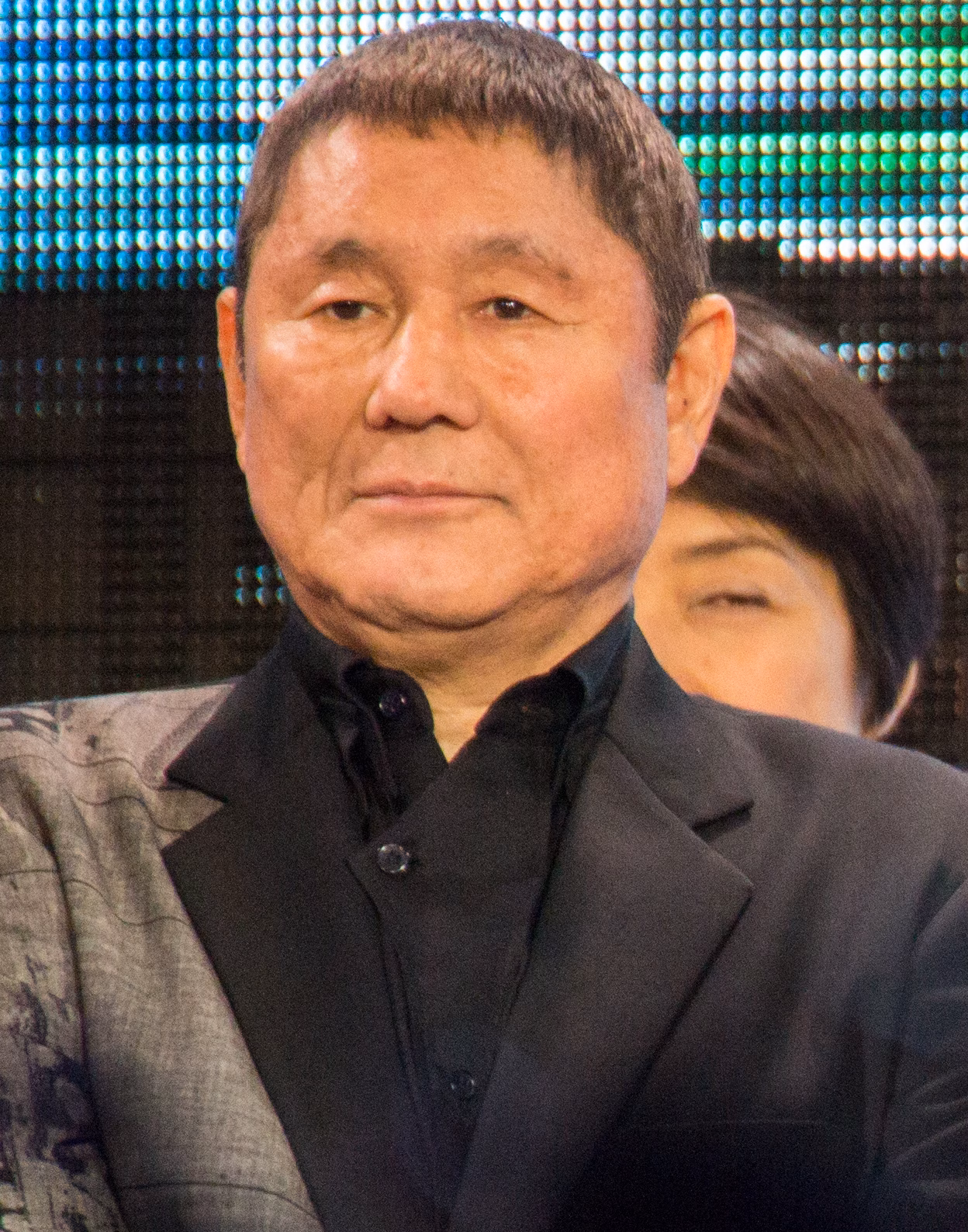 Takeshi Kitano in a dark jacket at a film premiere in Tokyo