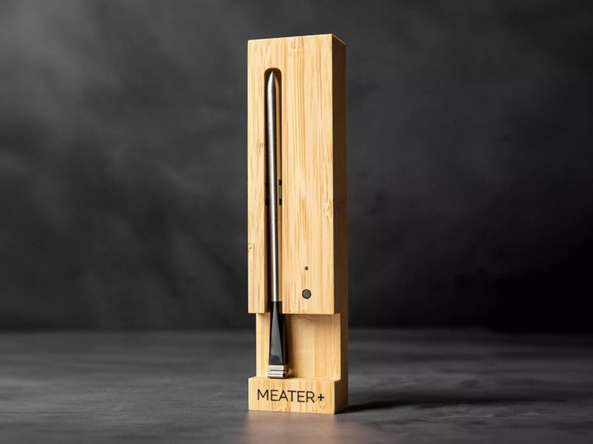 MEATER+ wireless meat thermometer probe in its bamboo charging block